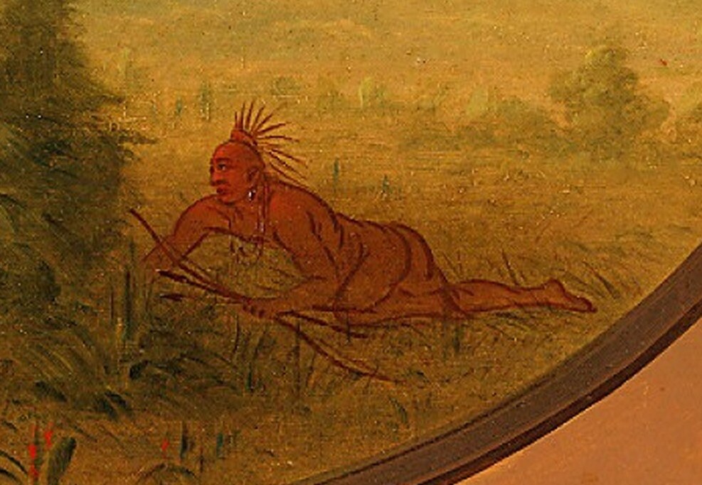 A lone hunter lies in wait, anticipating the charge.