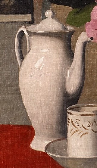 Its smooth, reflective surface and classic form anchor the left side of the composition.