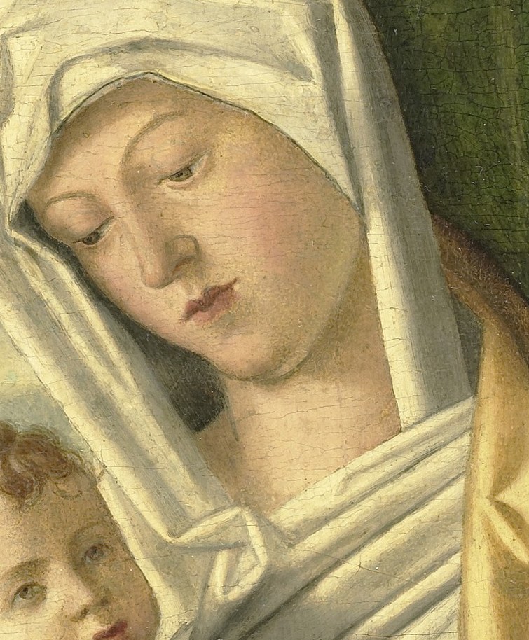 Her gaze is downcast, contemplating her son's fate.