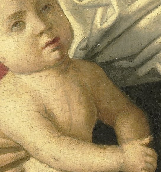 Mary cradles the Christ Child, a common religious motif.
