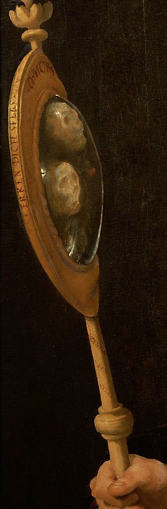 This mirror is shaped like a skull, a common reminder of mortality.