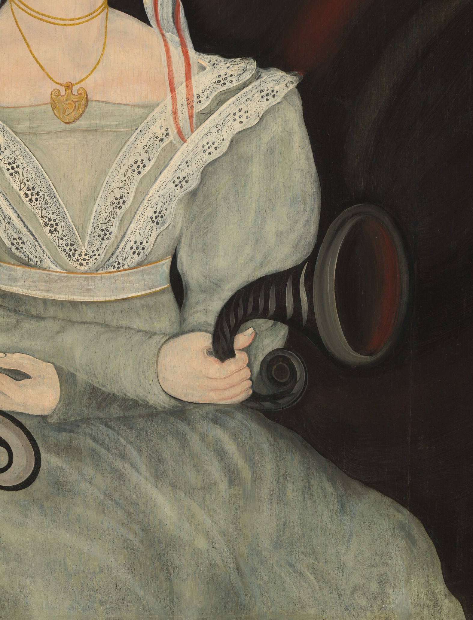 The pale green fabric with delicate white lace trim showcases the fashion of the era and the sitter's refinement.