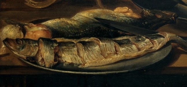 These whole fish, with their silvery skin and visible bones, appear uncooked and ready for preparation, adding a sense of freshness.