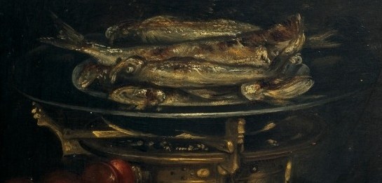 The glistening scales and slightly curled bodies show the fish are recently cooked, hinting at a meal prepared.