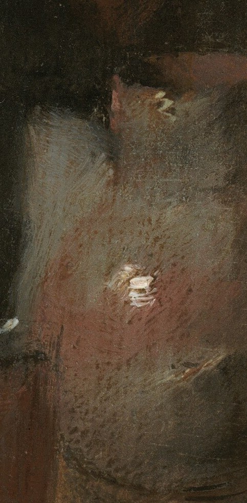 Here, a bottle and a worn table surface complete the story.