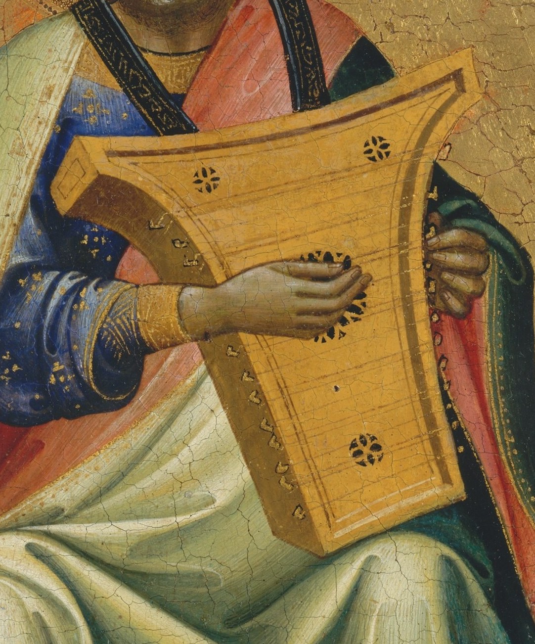 His golden harp identifies him as a musician and psalmist.
