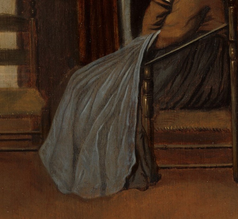 She looks like a woman alone with her sewing.