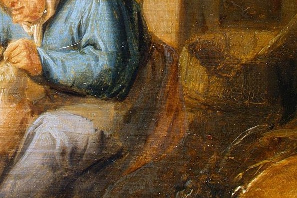 She wears a vibrant blue gown and a bright white headscarf.