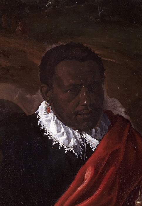 The man with the red collar looks stern.