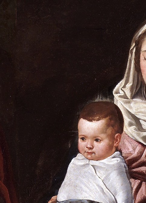 Her expression is one of gentle devotion and maternal love, conveying a sense of peace.