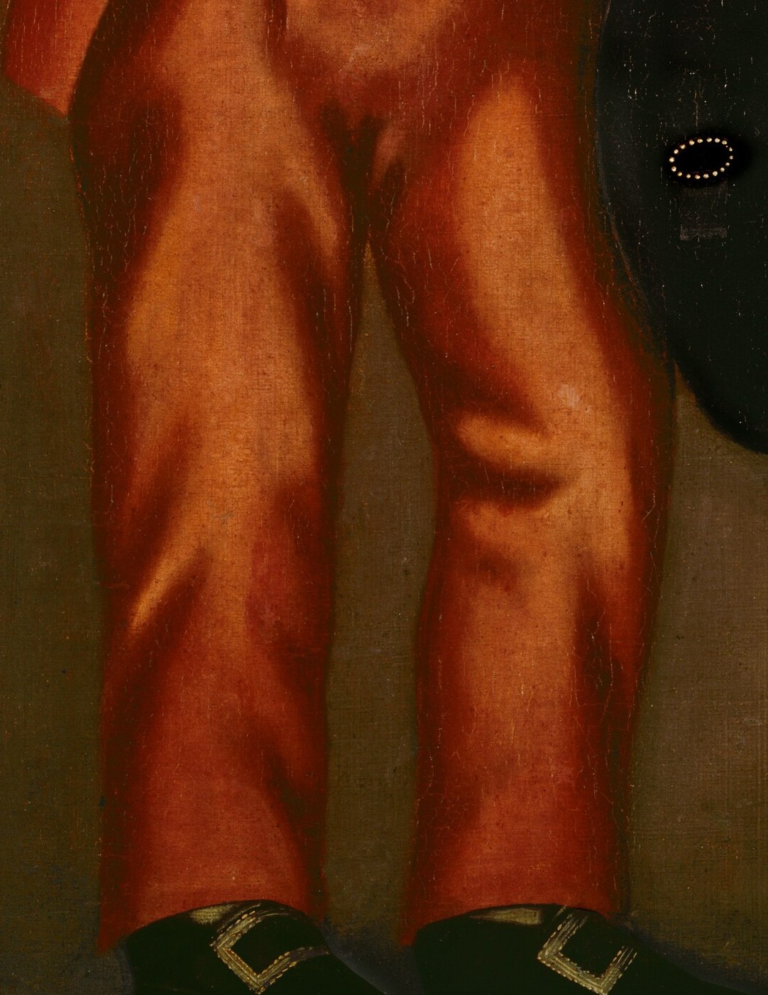 The smooth, unadorned fabric of the trousers draws attention to the sitter's posture and the overall formality of his dress.