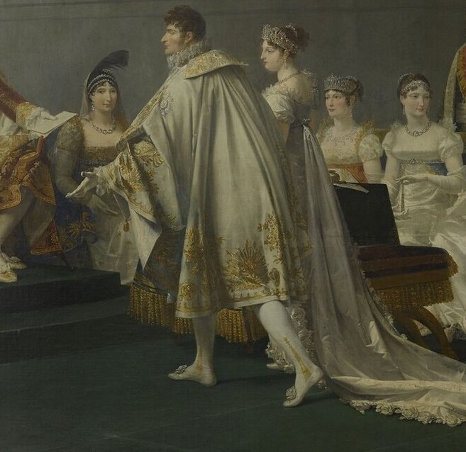 The man in white robes is a key dignitary.