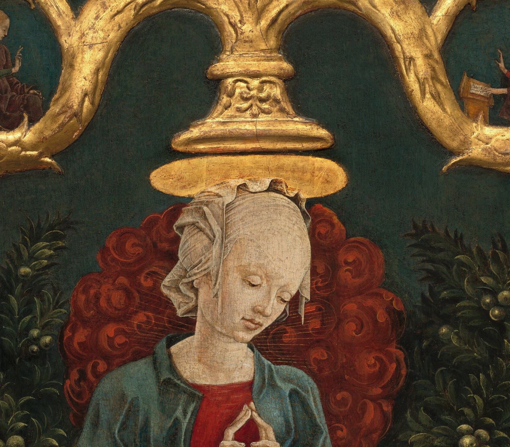 Unusually large and intensely red rather than the conventional gold ring , it reads almost like a blazing sun, asserting divine heat and majesty rather than gentle sanctity.