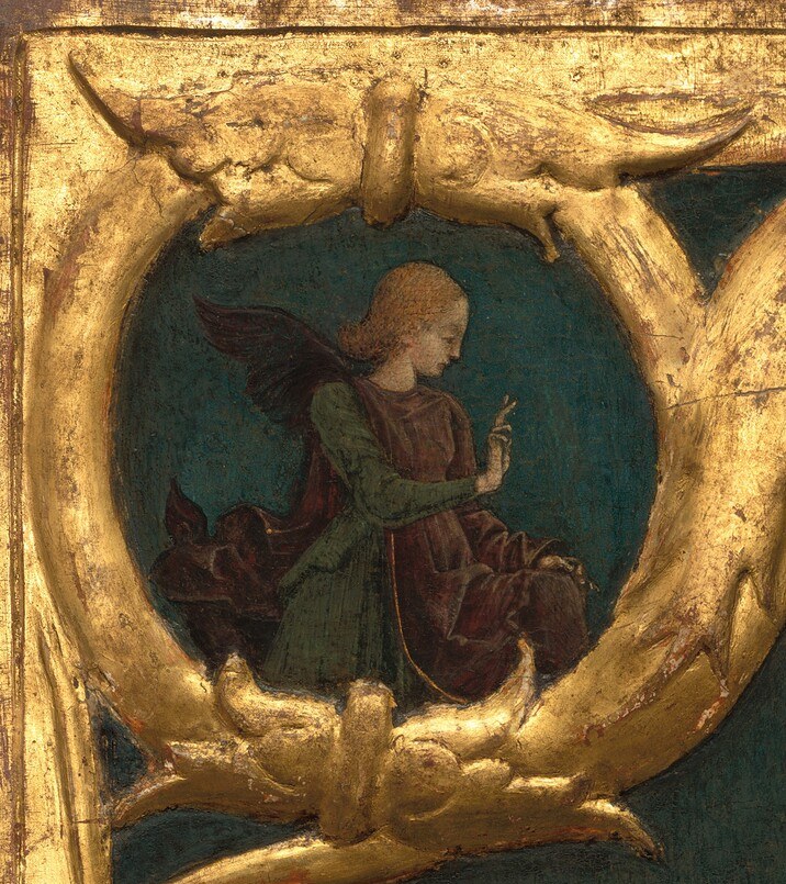 Now look into the upper left corner of that gold frame.