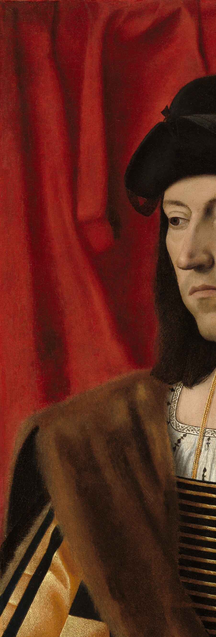 The deep red curtain serves as a conventional Flemish-influenced backdrop that both frames the sitter and creates a warm chromatic counterpoint to the outdoor scene.