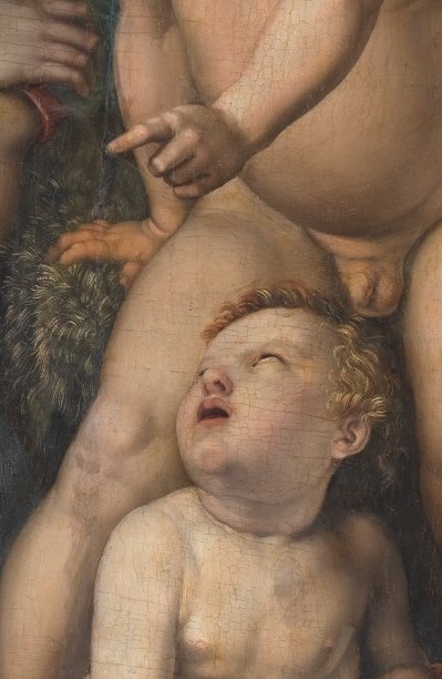 But the young John the Baptist gestures pointedly.