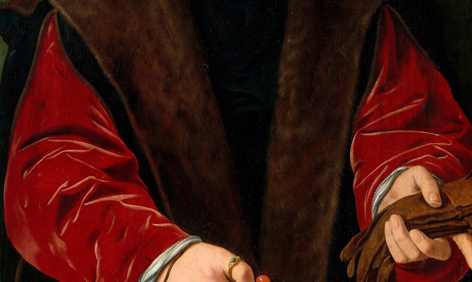 The red robe and fur collar shout wealth and power.