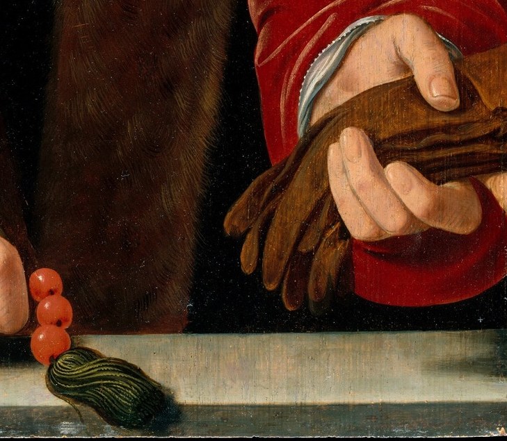 But look at his other hand.