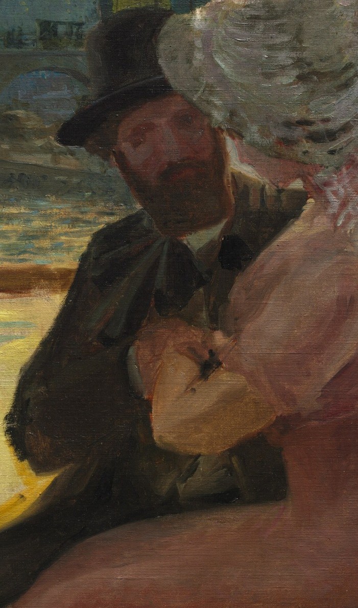 Her companion, in a dark hat, sits in shared silence.