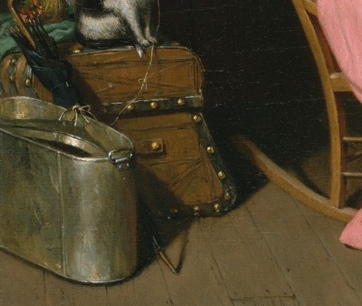 A domestic mascot that has already made itself at home; its relaxed presence contrasts with the human bustle and adds a gentle humor