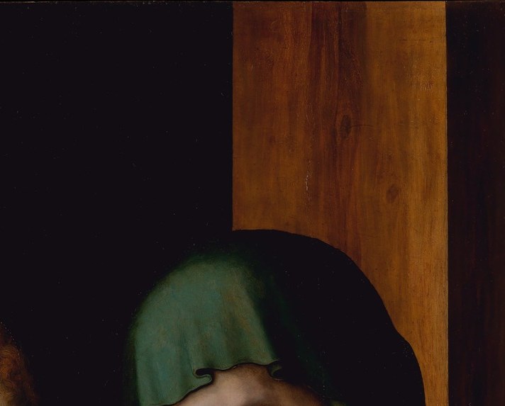 Morales clothes Mary in green rather than canonical blue , a theologically charged substitution signaling hope within grief; the cloth folds display his control of highlight on a smooth walnut panel.