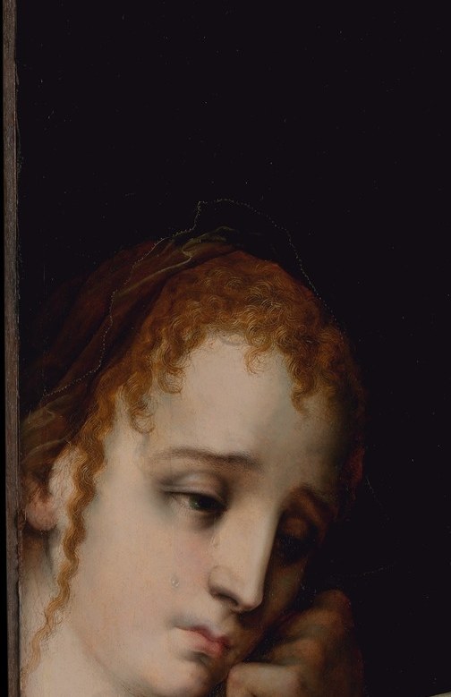 Her averted gaze and parted lips suggest barely contained anguish; her youth against the Virgin's settled grief adds a second register of sorrow at the left margin.