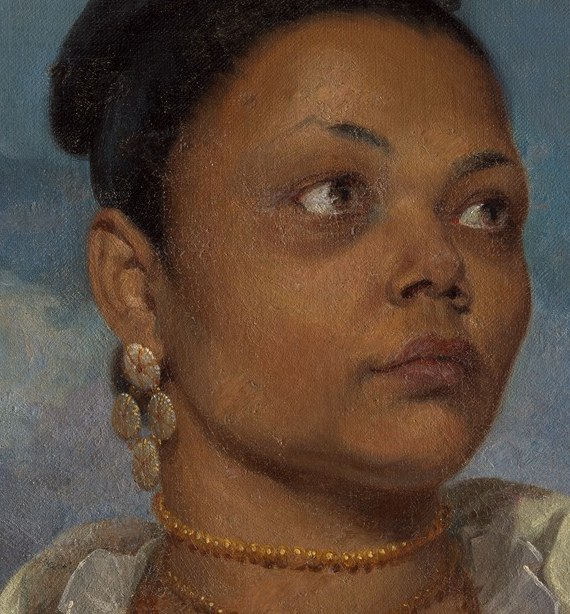 Her direct gaze and subtle expression convey a sense of inner thought and dignified presence.