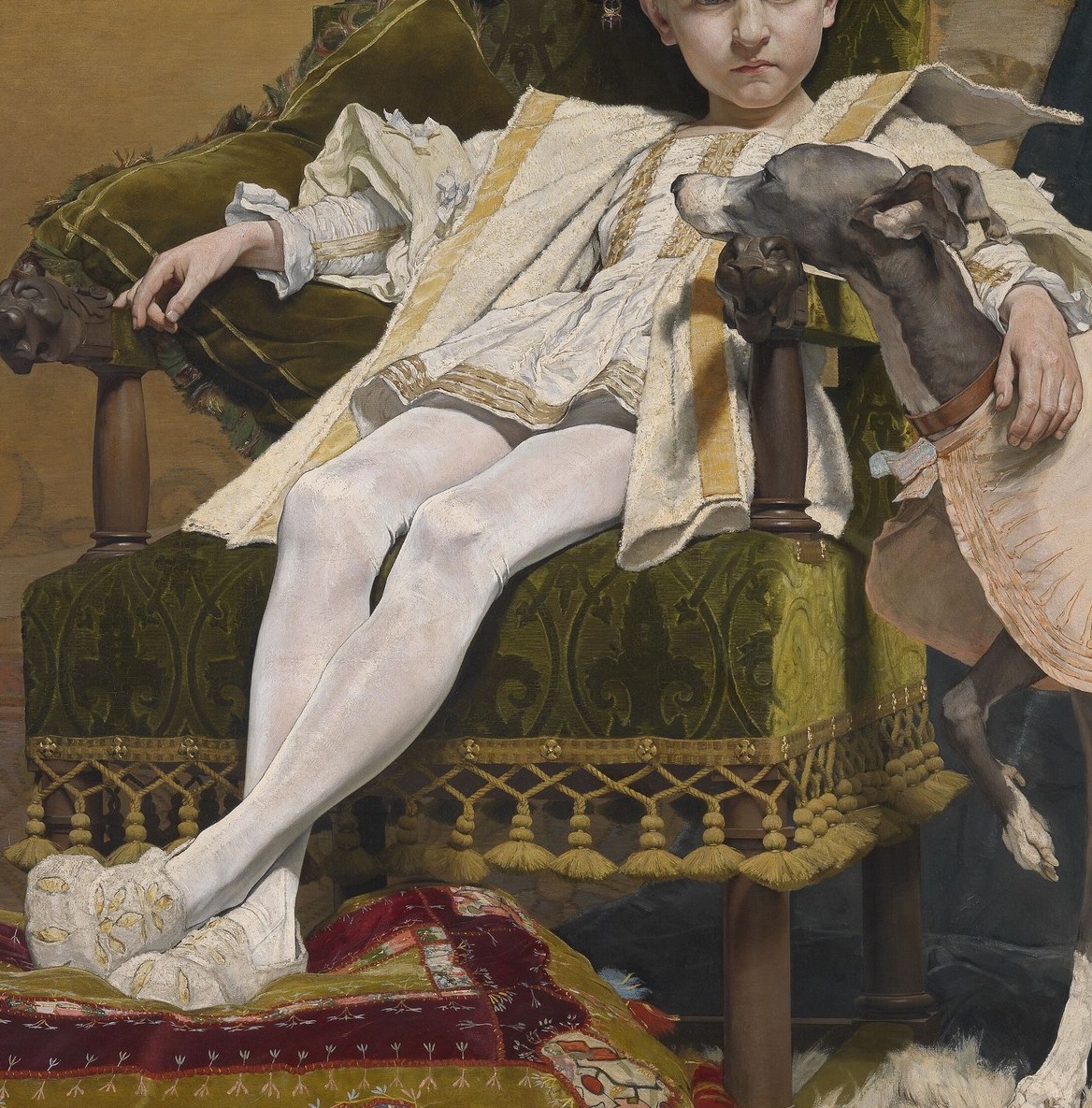 He is surrounded by wealth, from his chair to his dog.