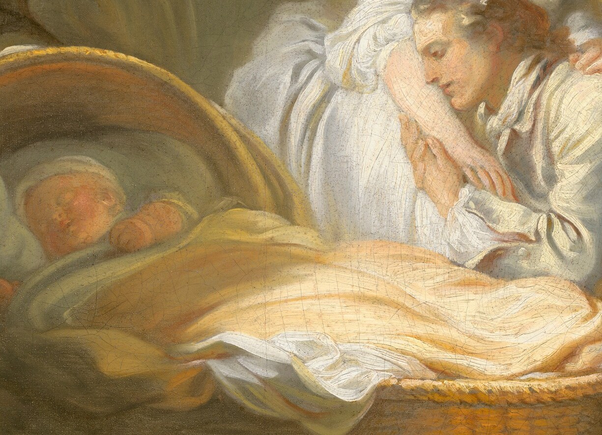 Notice the quiet, focused attention on the newborn baby.