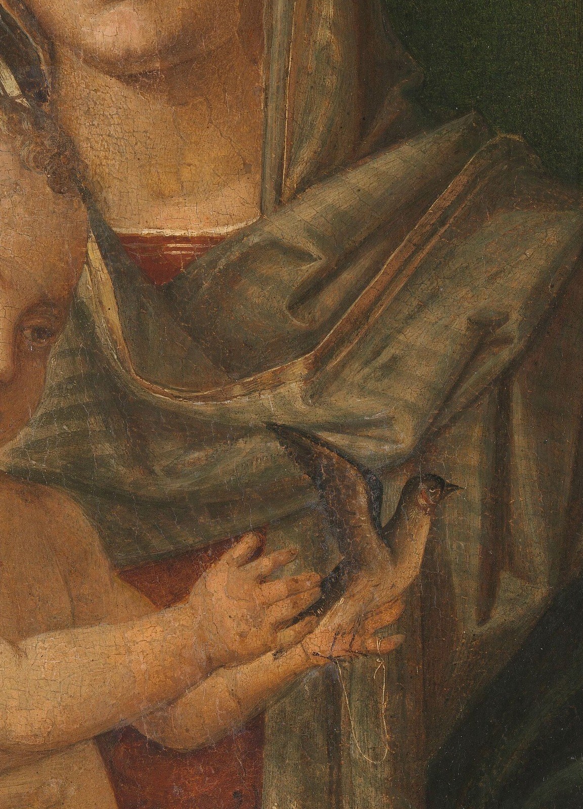 See the soft, almost glowing skin of the Christ Child.