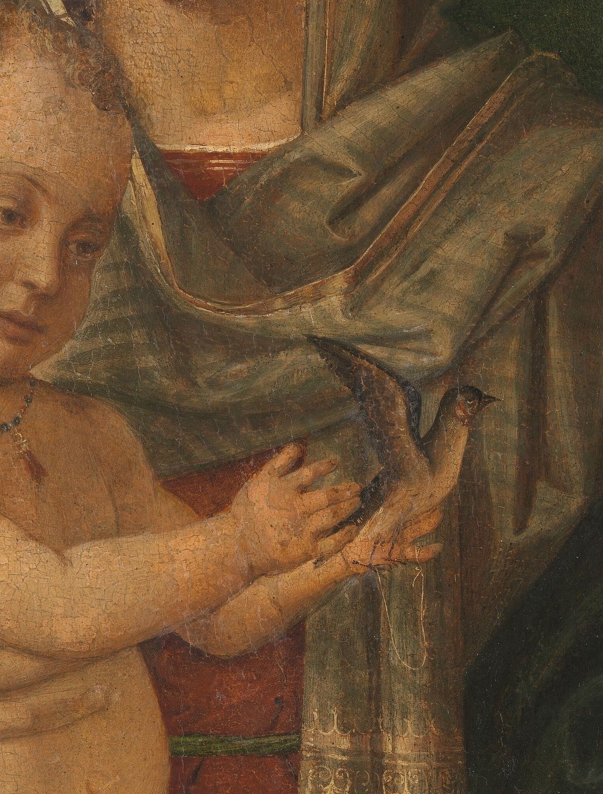 Her protective grip shows the physical bond and her role as guardian.