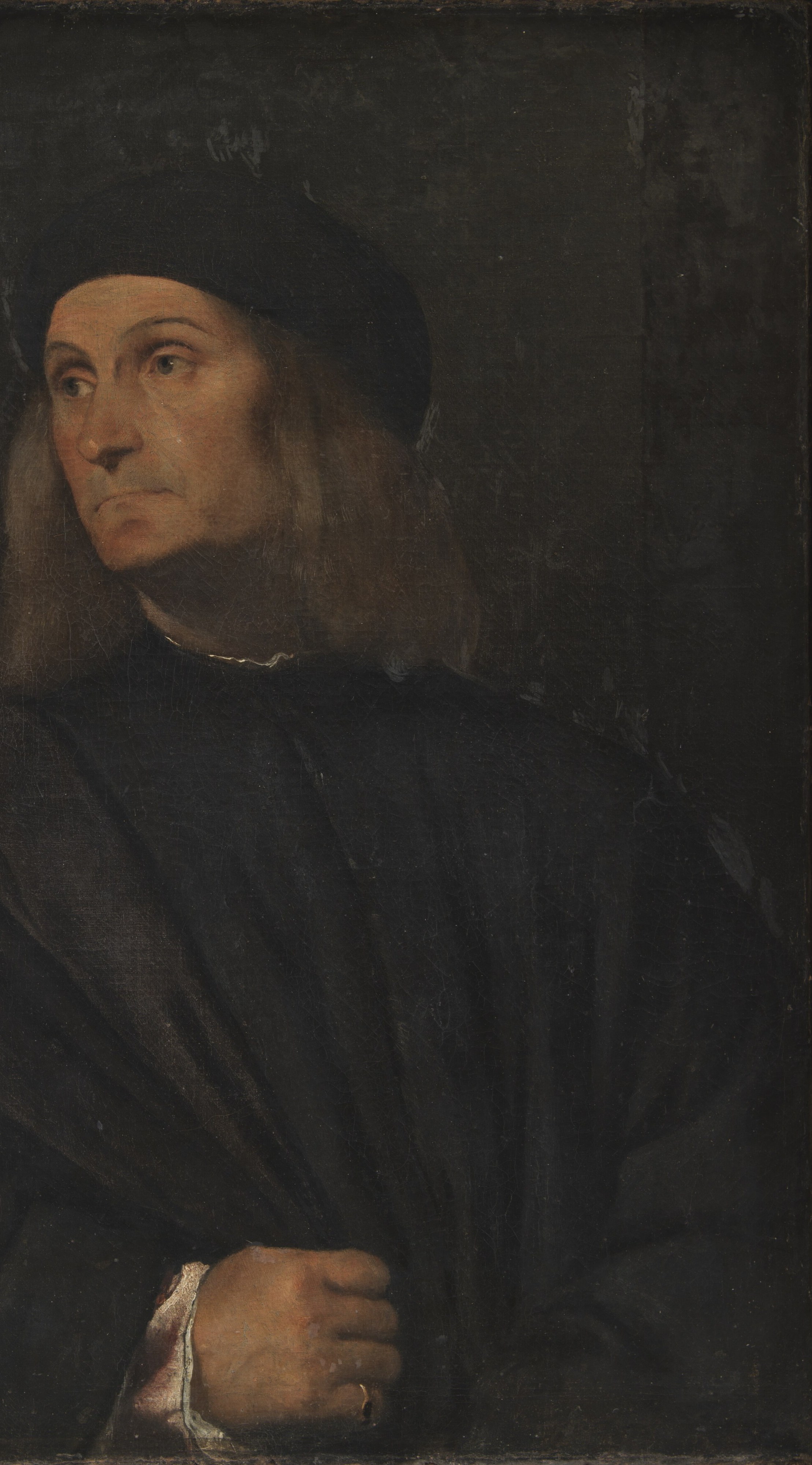 The deep, dark background isolates the figure, intensifying the focus on his presence and inner world.