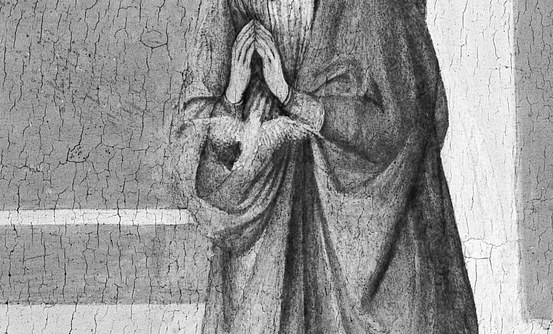 Mary folds her hands in acceptance.