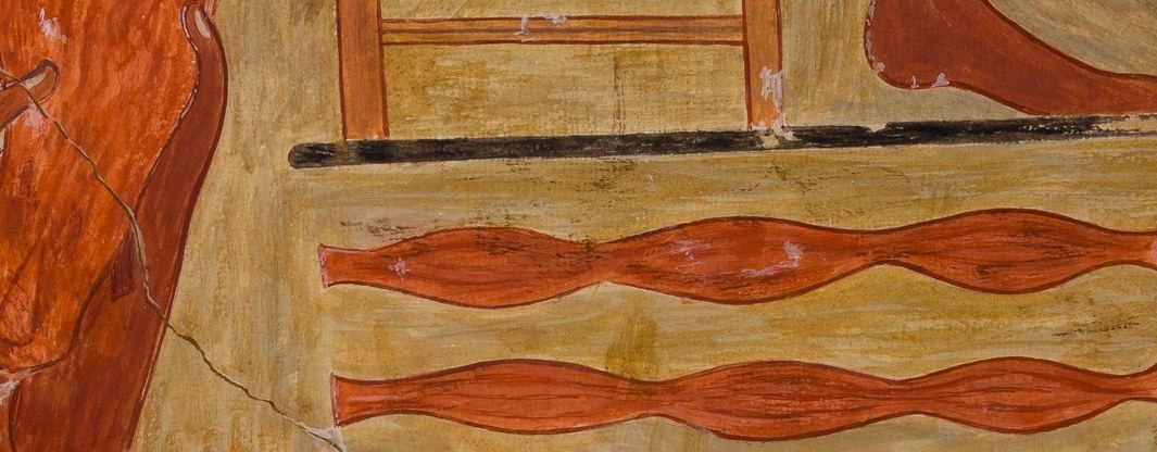 Look above the workbench at the reddish bands.