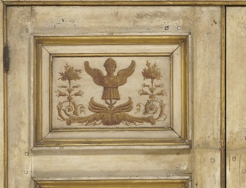 Symbol of power and victory, its prominent placement suggests authority.