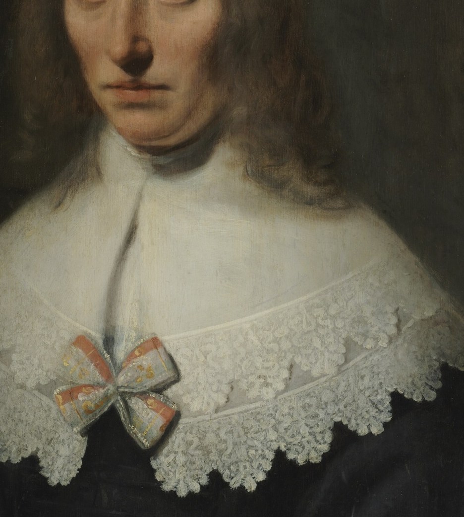 Her white robe has a subtle leaf pattern.
