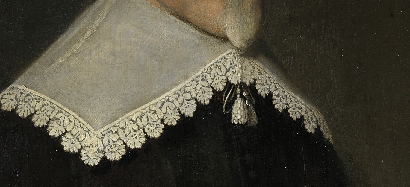 The intricate lace collar shows wealth.