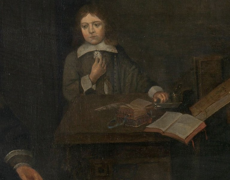 Books on the table show the children are being educated.