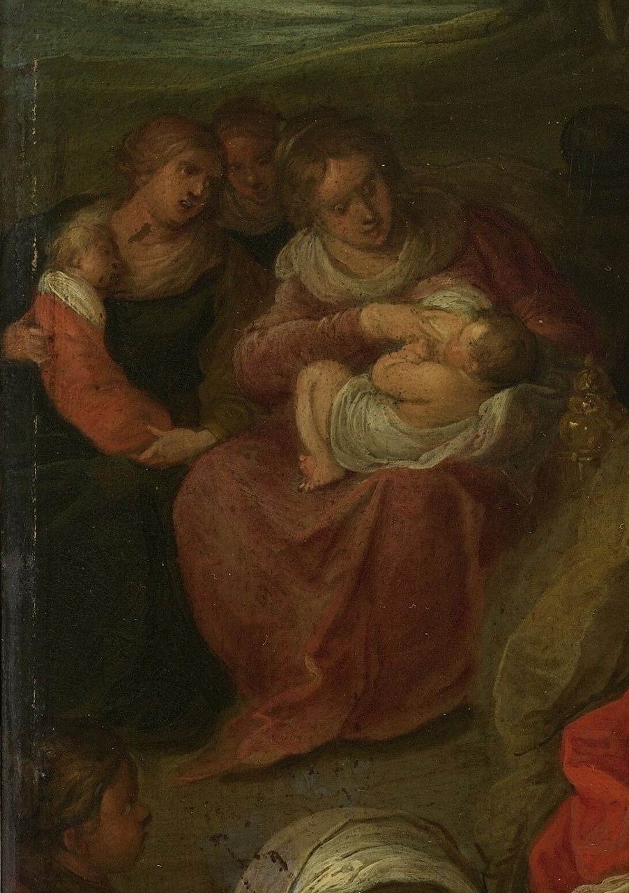 Beyond, a woman holds another baby, a human touch.