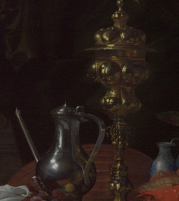 The elaborate metalwork catches light along its curved surface, showcasing de Heem's mastery of rendering specular reflections on hammered gold , a technical tour de force.
