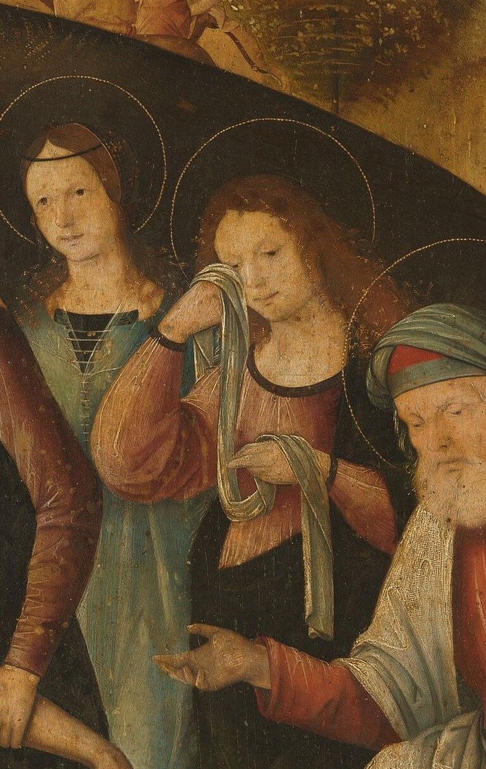 The Virgin Mary grieves, her hand touching his arm.