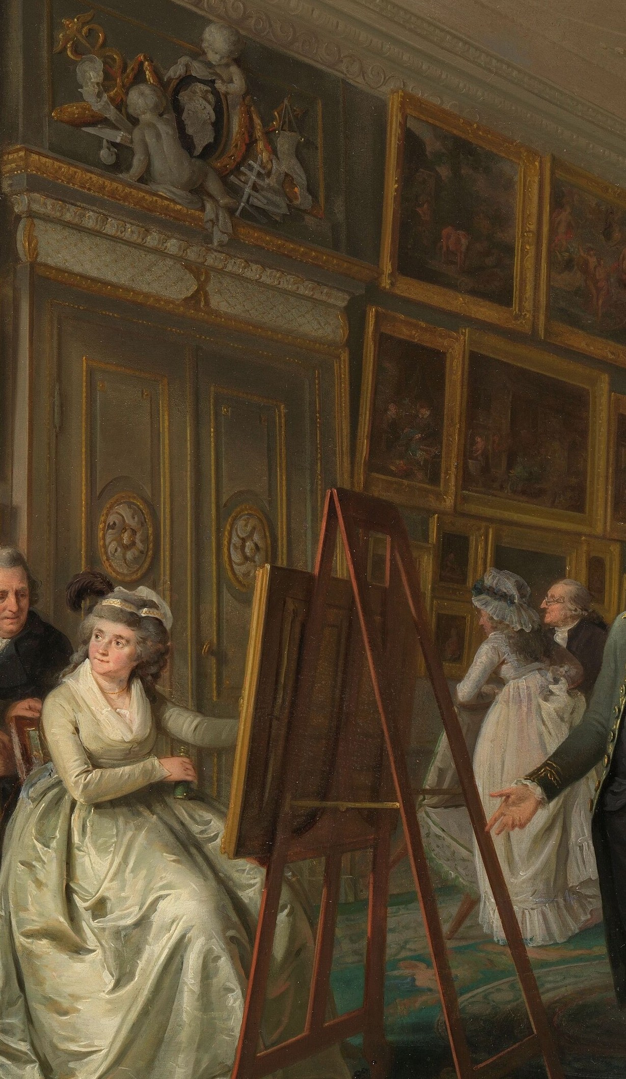 The largest and most luminous figure; her white dress catches the gallery light and anchors the social occasion as a genteel cultural event
