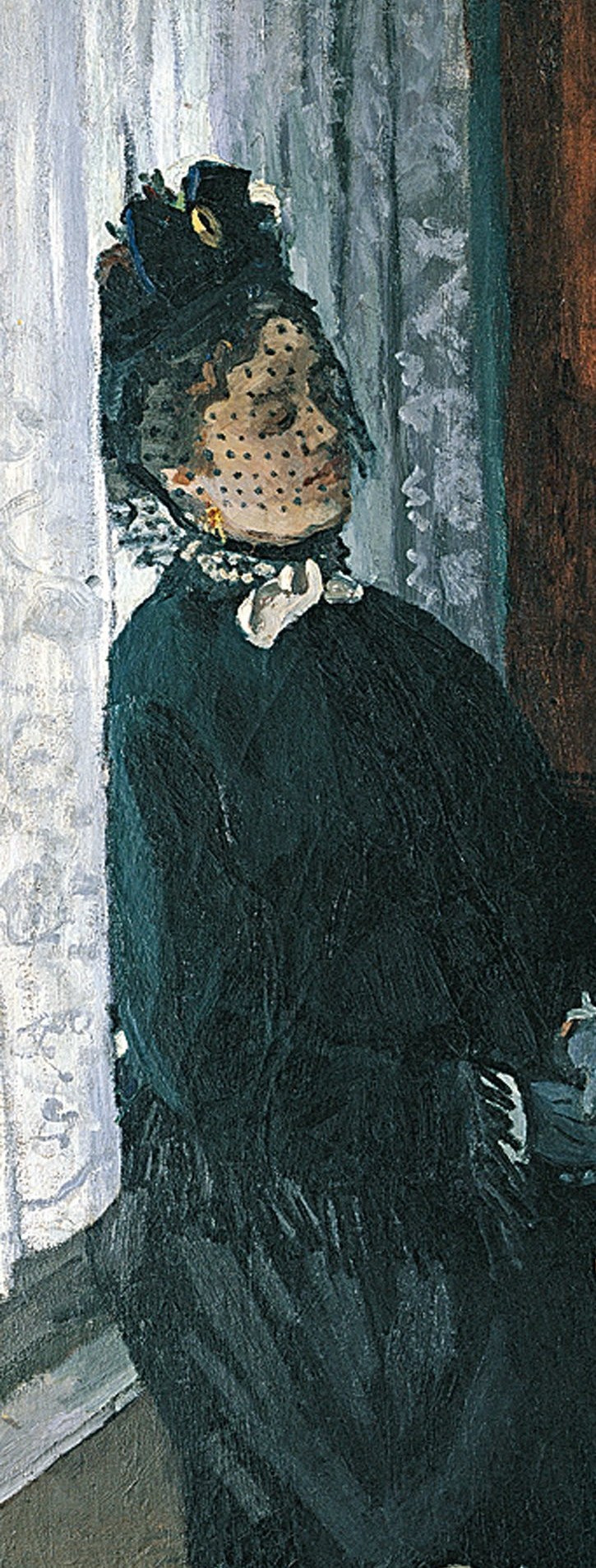 But look closely at the woman in the black veil.