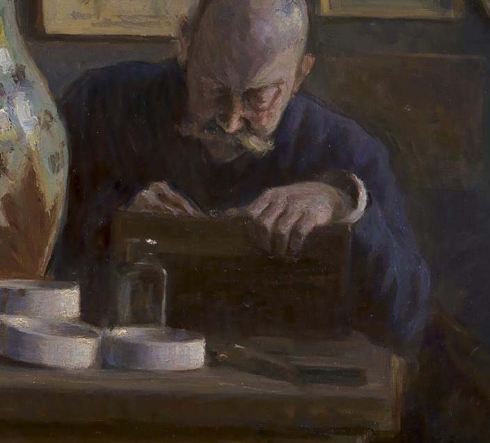 His gaze locks onto his current project.