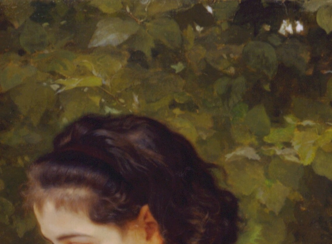 She studies something in her hands with quiet concentration, a contrast of absorbed attention against the left girl's dreamy gaze , two temperaments in one frame.