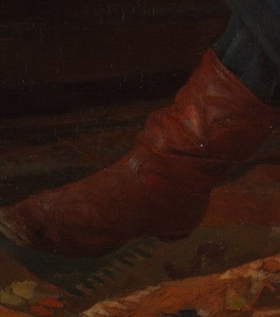 The vibrant red of the boots provides a striking contrast to the otherwise muted tones of the room, adding a touch of unexpected boldness.