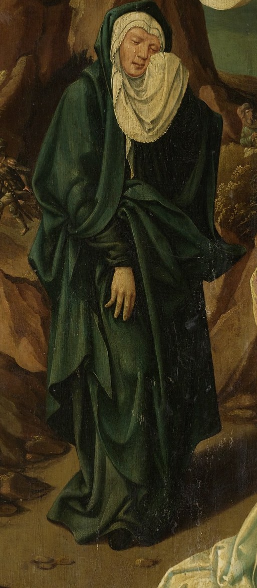 The Virgin Mary, in green, is veiled in sorrow.
