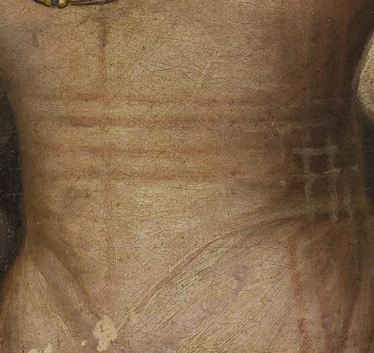 Her dress fabric has a subtle sheen and texture.