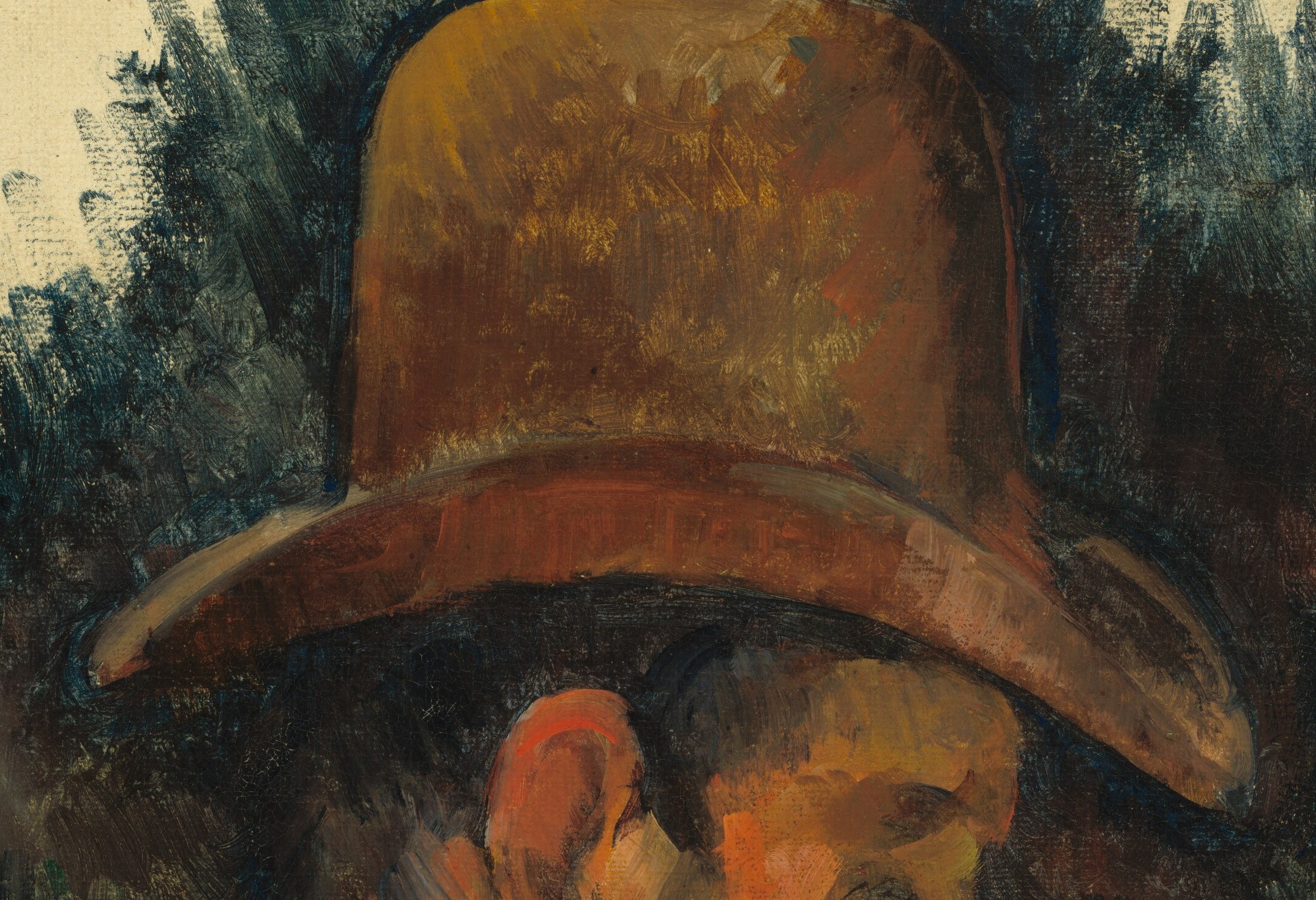 The hat's brim casts a shadow, adding depth and a sense of mystery to the subject's face.