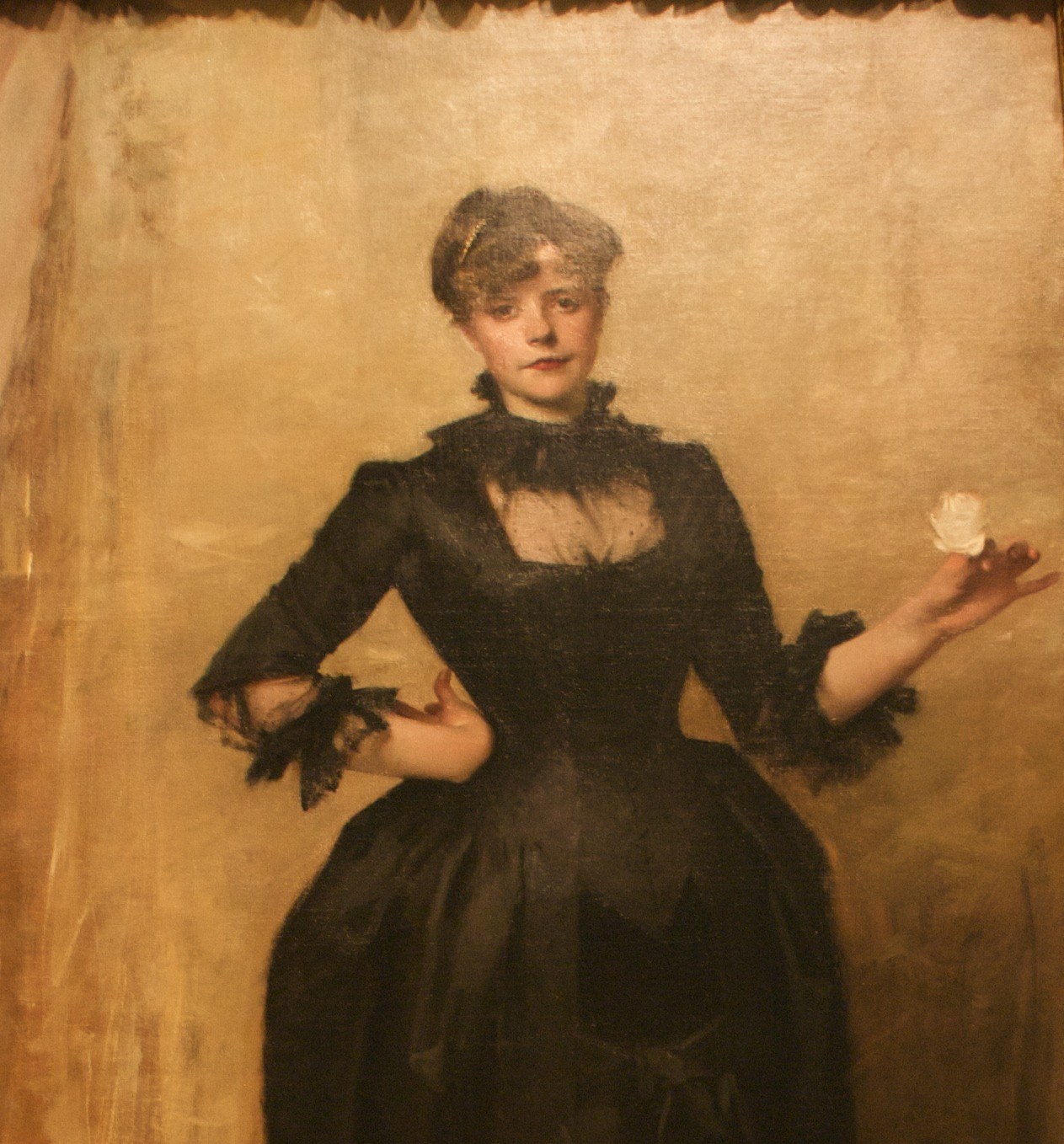 Not a neutral void , tonal gradients and visible brushwork variation give the background its own quiet life, echoing Spanish academic portraiture and preventing the dark figure from flattening.